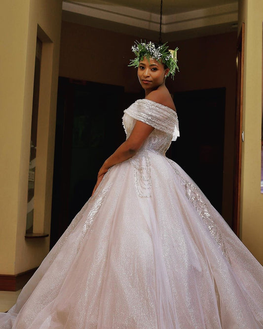 Shimmery wedding gown with a metallic finish that catches the light beautifully