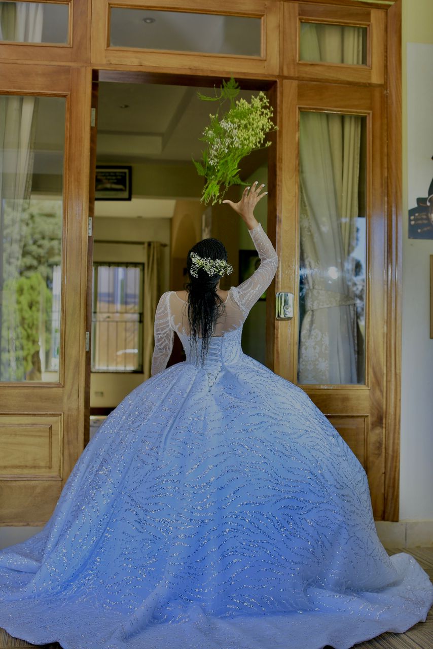 Shimmery wedding gown with a metallic finish that catches the light beautifully